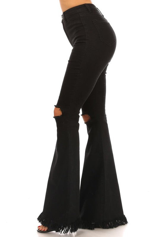 Black distressed knee jeans with fringe hem