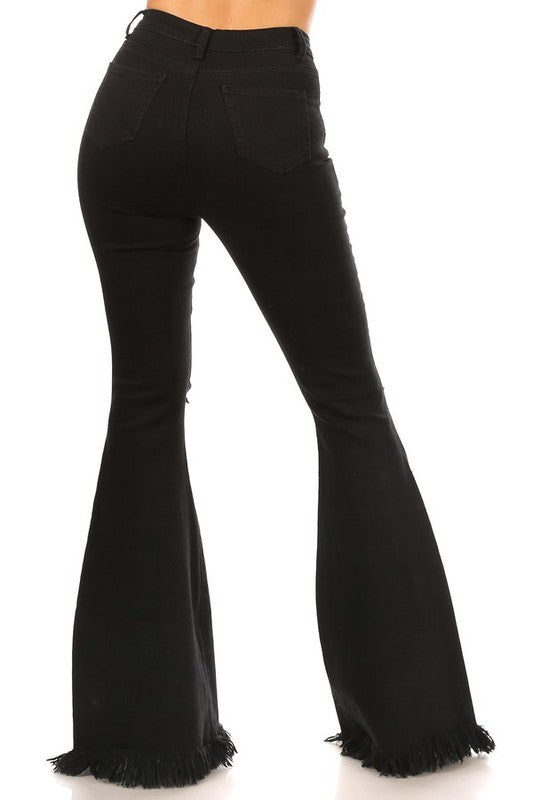 Black distressed knee jeans with fringe hem