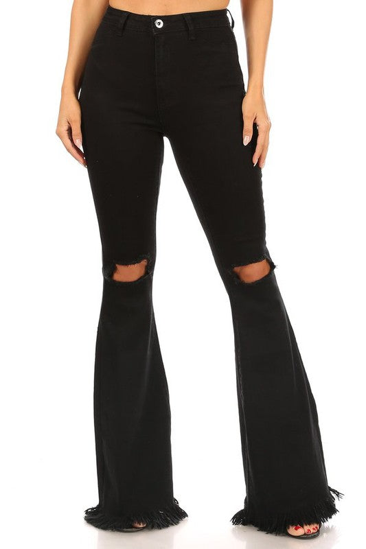 Black distressed knee jeans with fringe hem